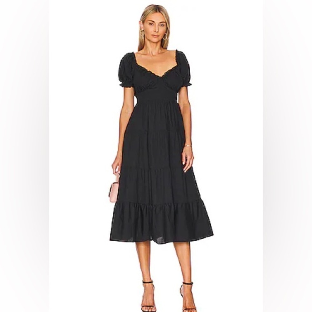 Astr puff sleeve with elastic waist at back and side zipper. NWT. Size XS.